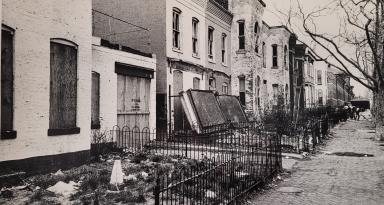 This photograph depicts rundown homes on 7th St SW, a few blocks south of Minnie Keyes' own home. [Reprinted with permission of the DC Public Library, Star Collection ©Washington Post]